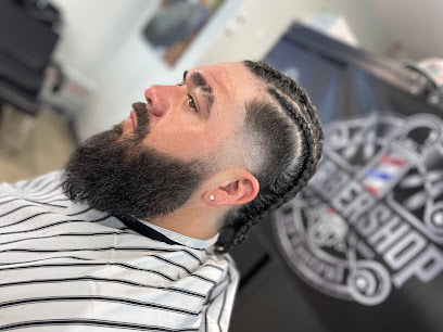 Sharp beard shape-up and textured taper fade by EP Central Barbershop in El Paso